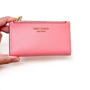 Kate Spade New York Morgan Small Slim Bifold Wallet in Salmon Pink Leather